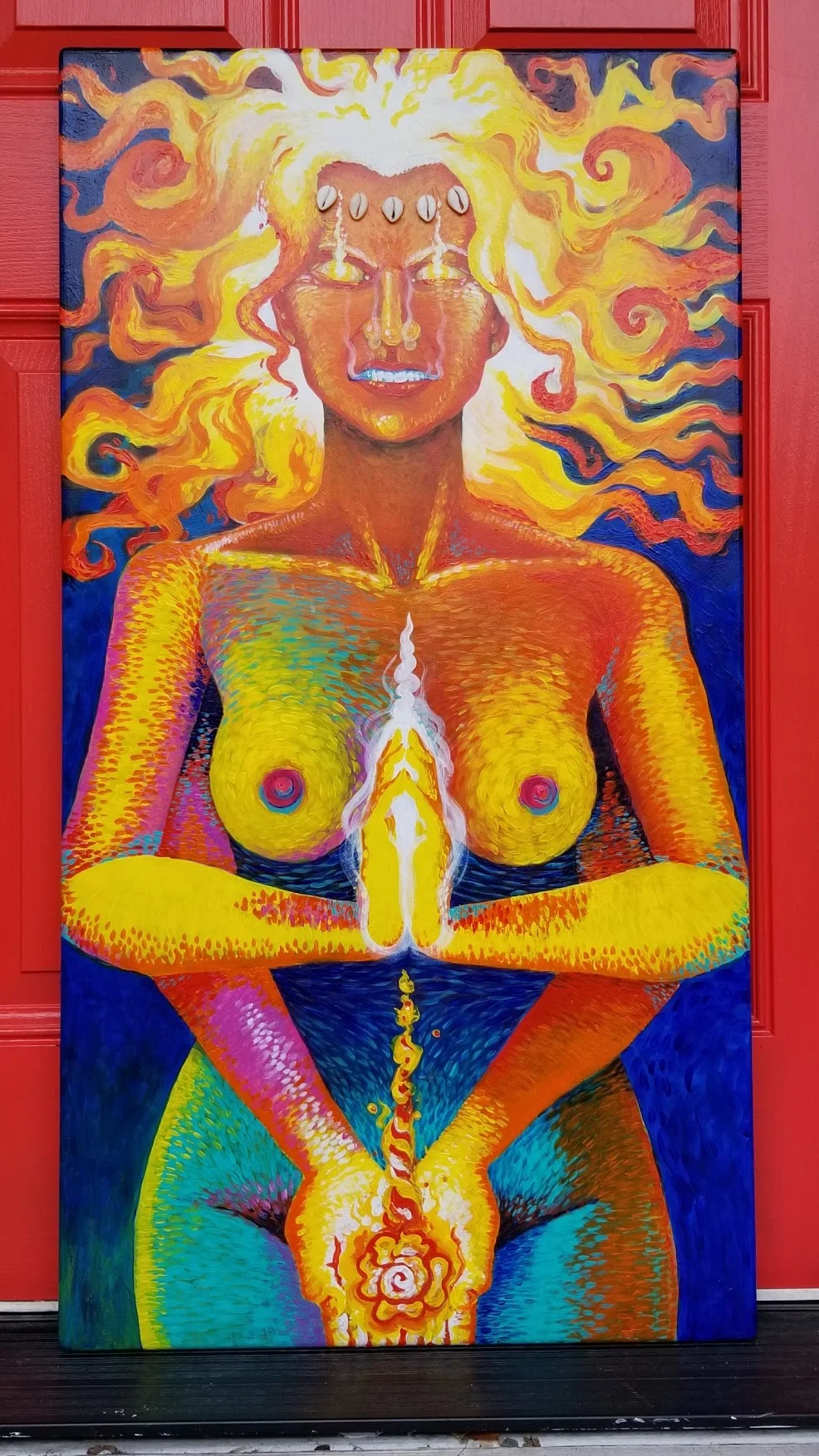 Vibrant seated figure with flowing fiery hair in meditative pose on canvas